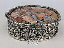 Silver box with a set stone into the top. #