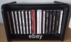Le premier ensemble de CD complet des Beatles c1988 dans une boîte à rouleau noire avec livret